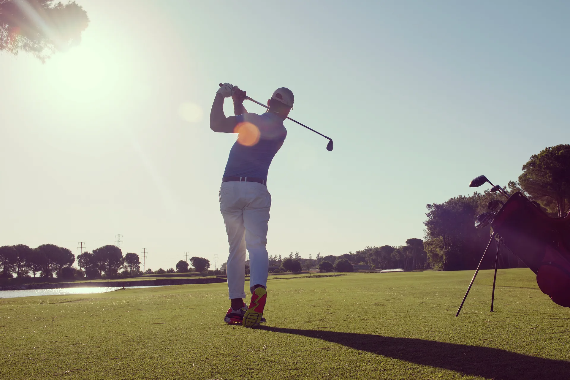 42466358 golf player hitting shot