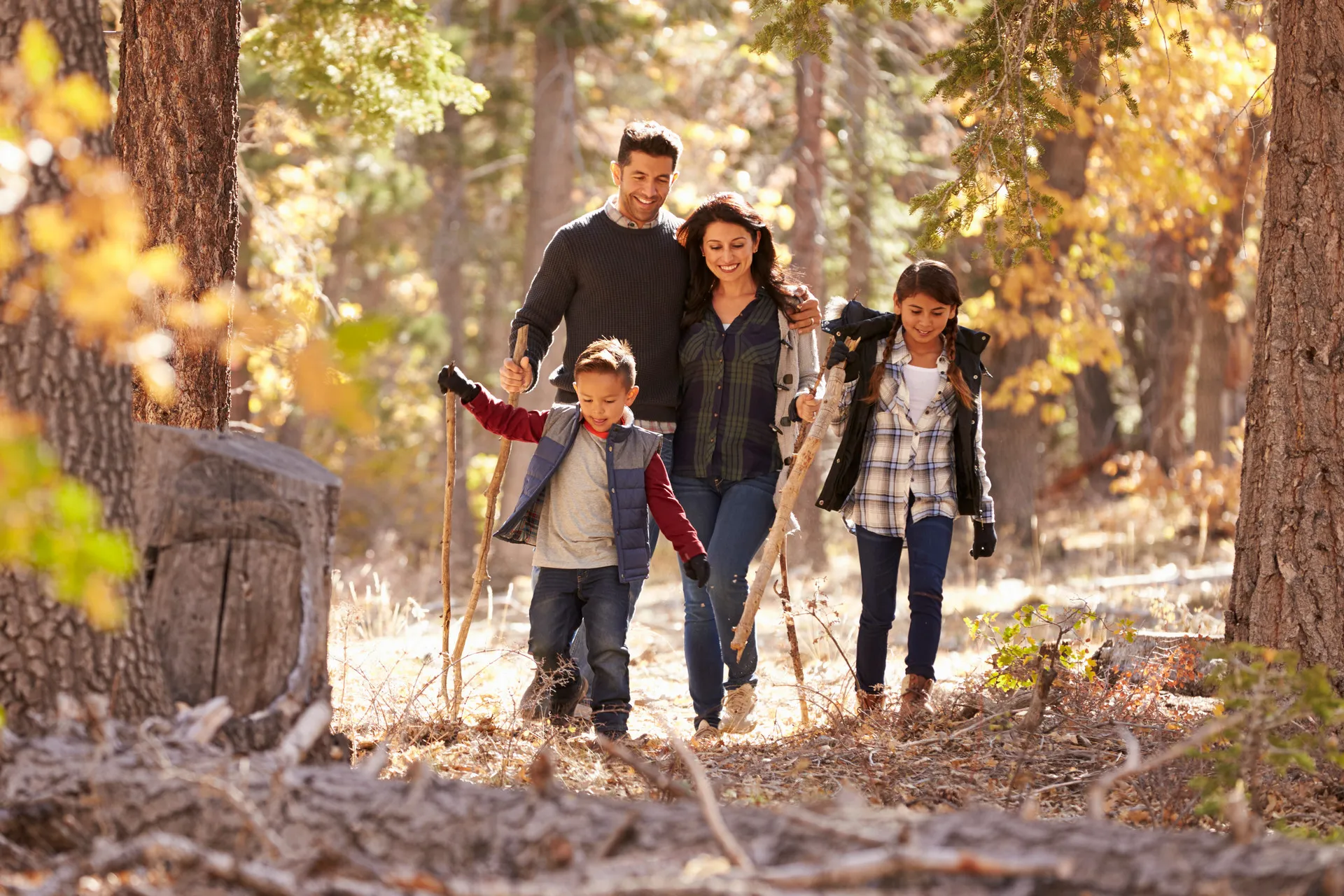 74537238 happy hispanic family hiking
